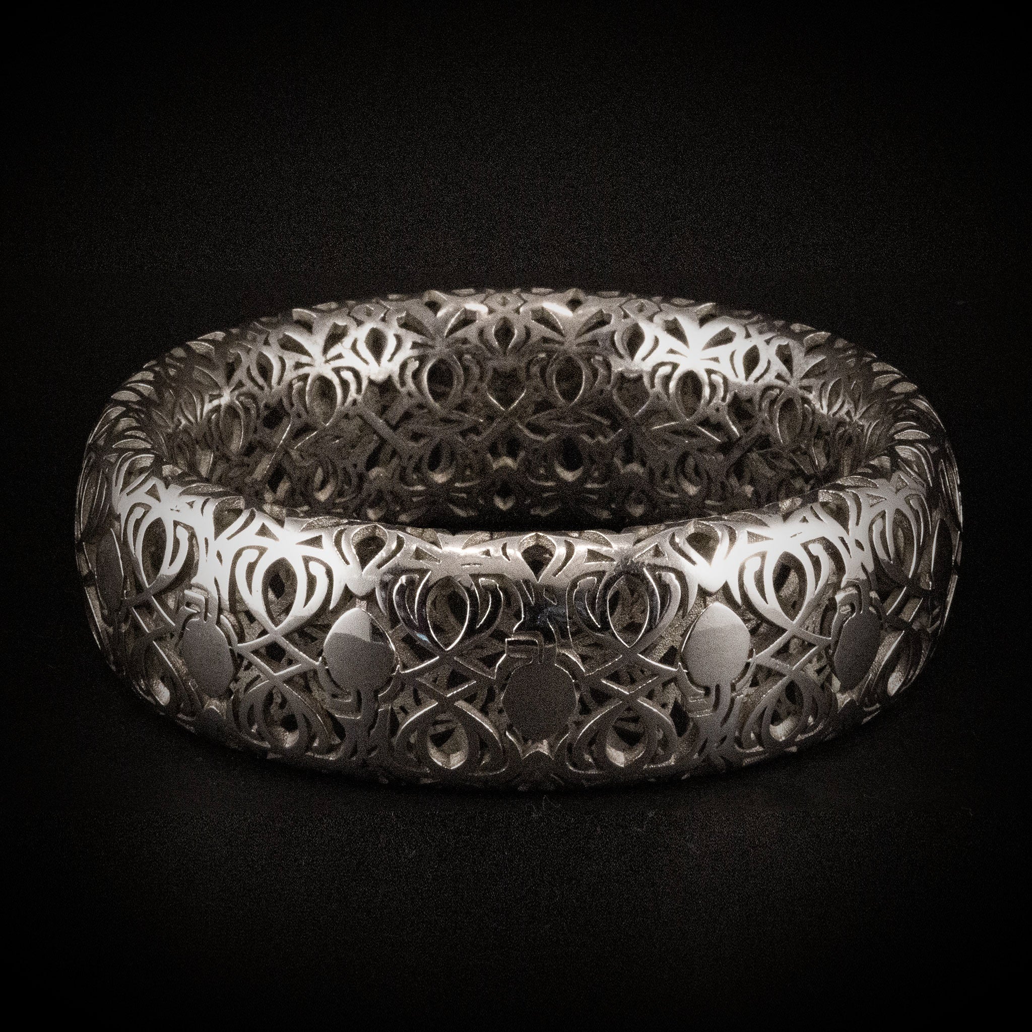 Rose gold and Sterling silver twig bangles on trumpet