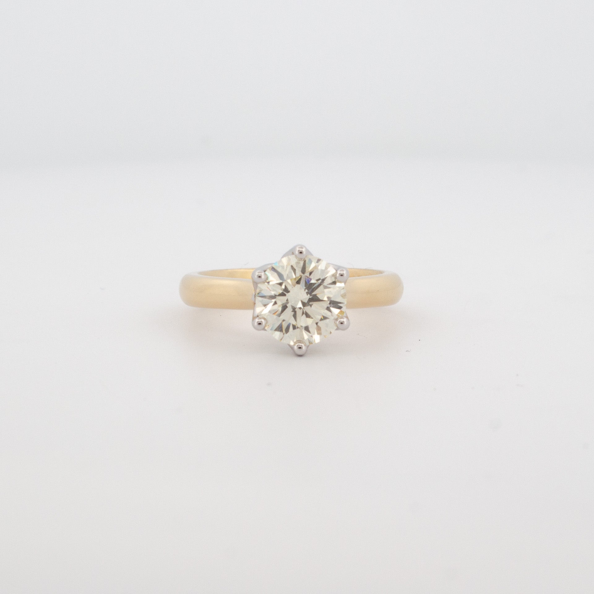 2ct brilliant cut diamond ring with six claw setting, 18ct yellow and white gold band, remodelled using recycled gold