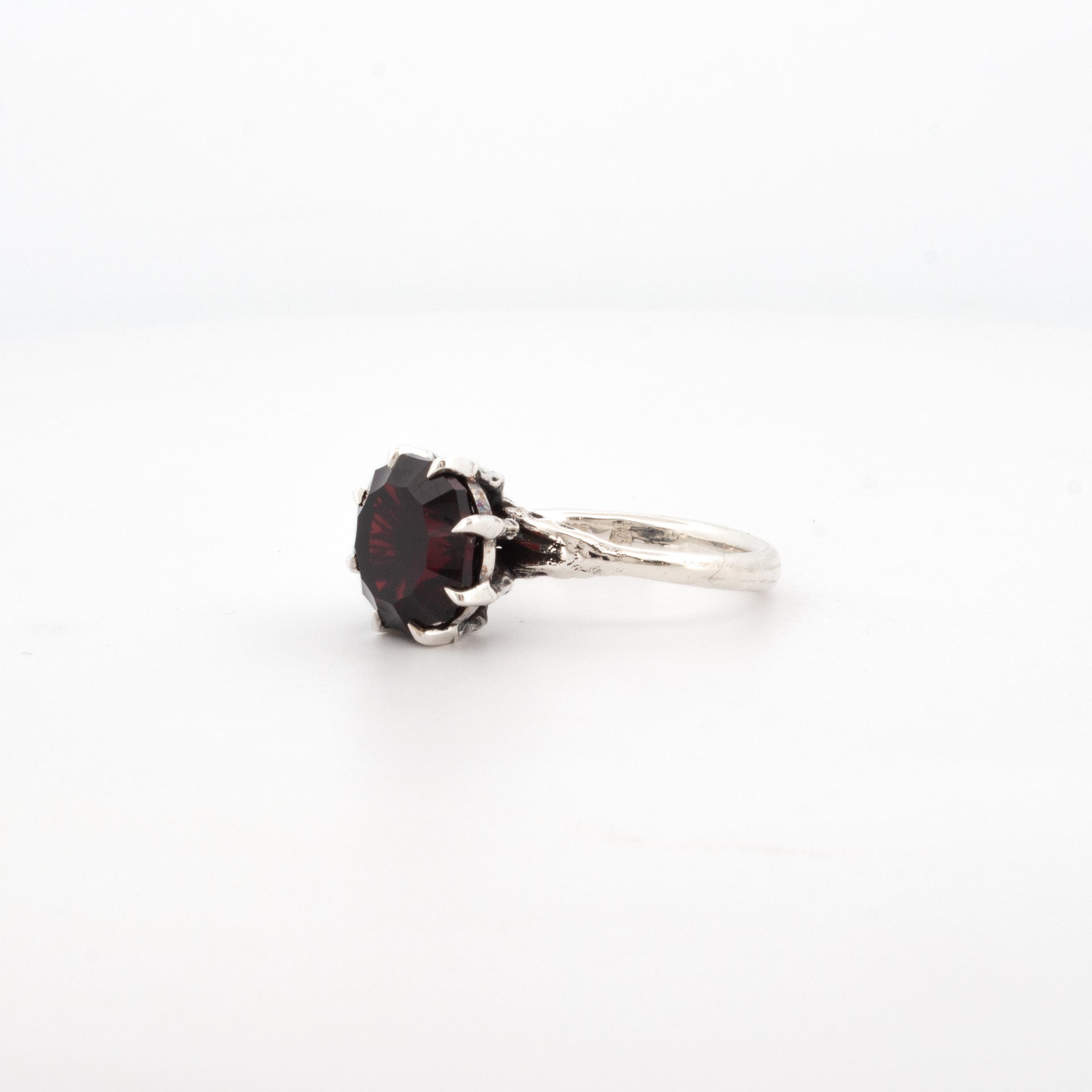 Sterling silver ring with custom cut deep red garnet, claw setting with sculpted talon prongs, gothic handmade design