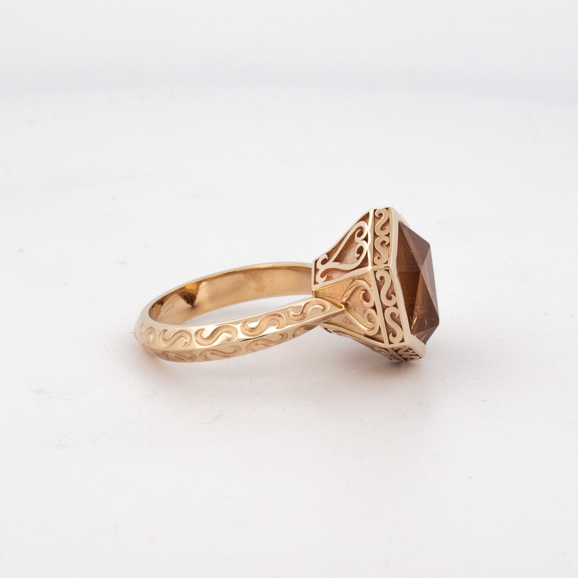 side view of 9ct yellow gold hexagonal citrine ring with custom-cut gemstone and carved band, gothic-inspired Titania design.