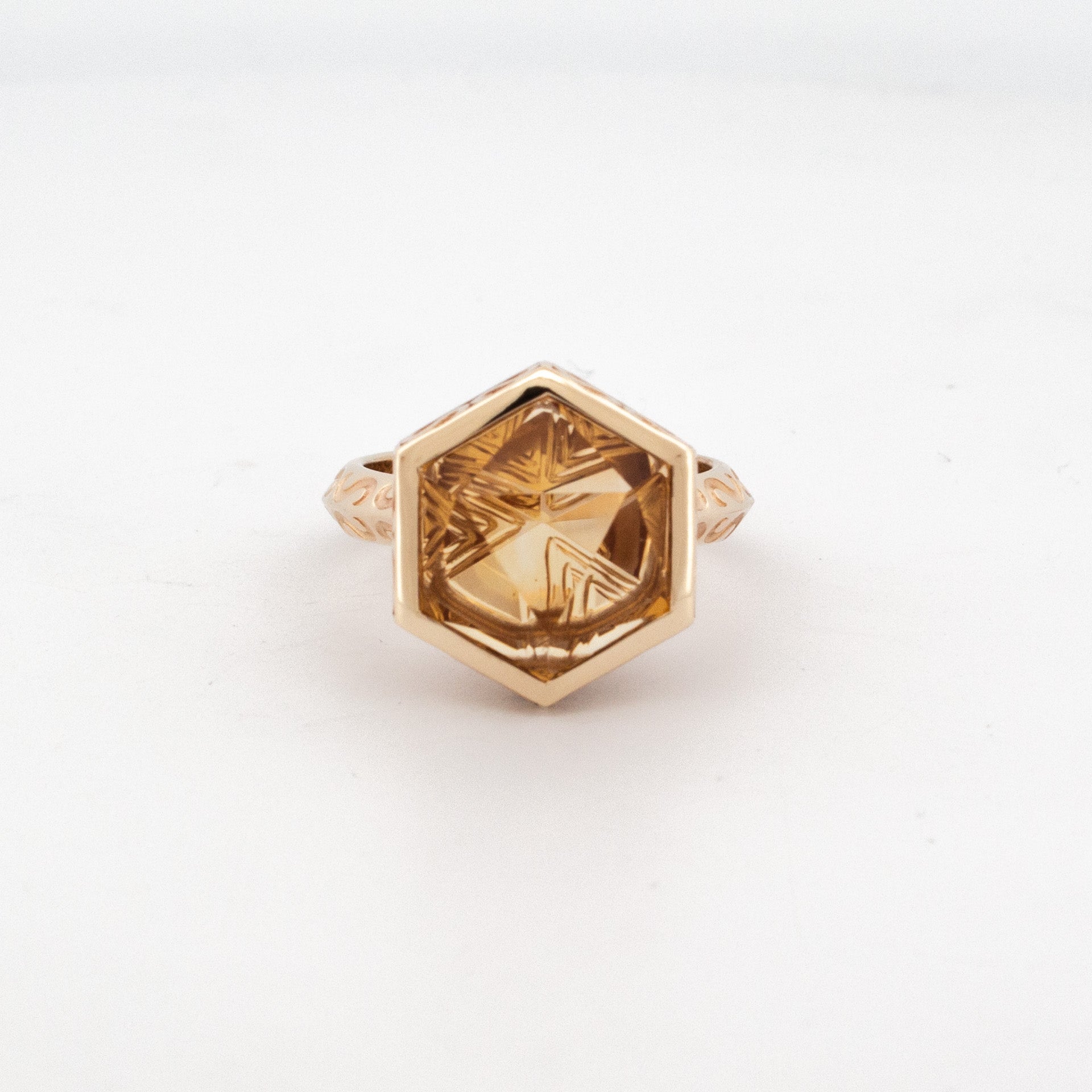 9ct yellow gold hexagonal citrine ring with custom-cut gemstone and carved band, gothic-inspired Titania design.