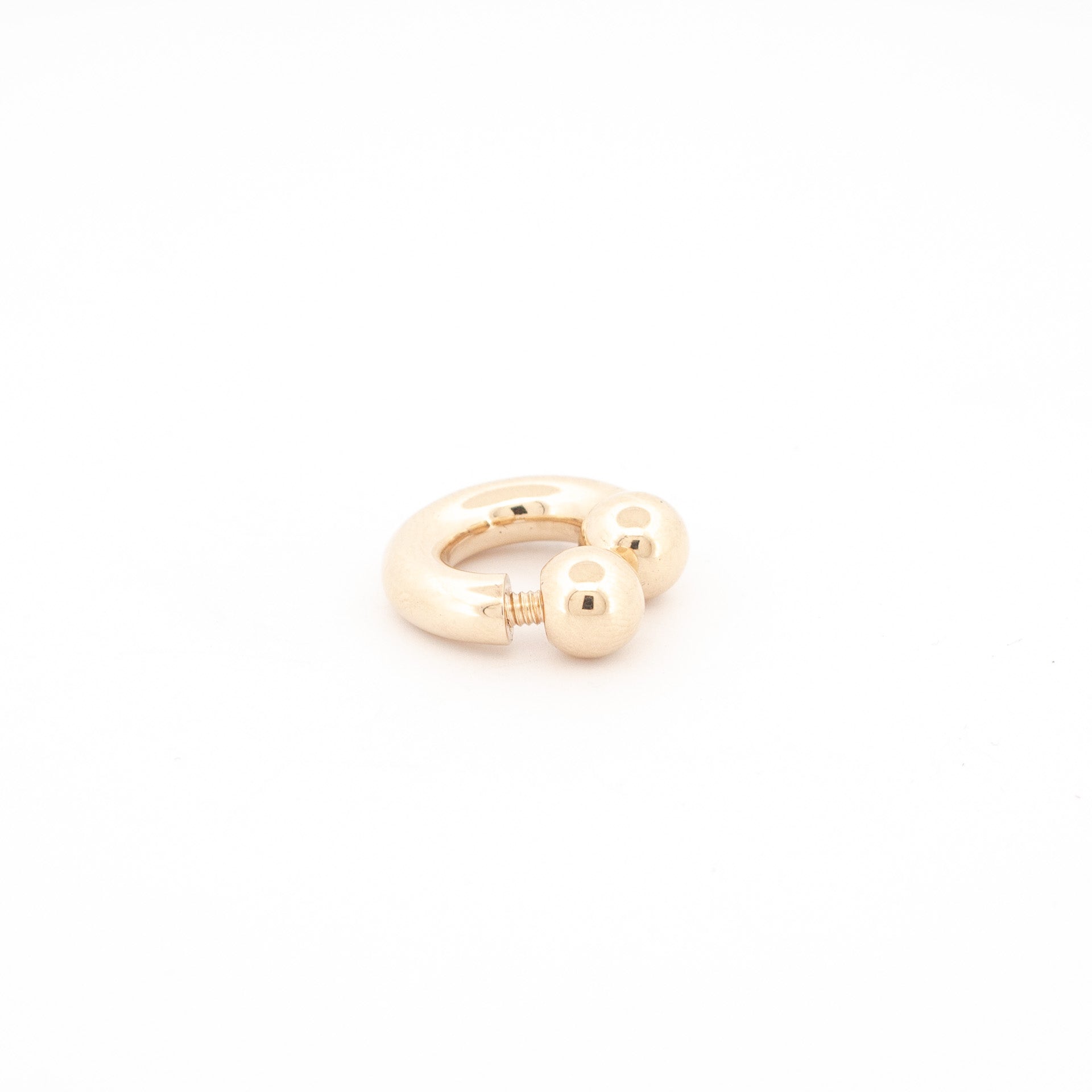 custom made 9ct gold septum piercing jewellery, with a golden finish aand screwball opening