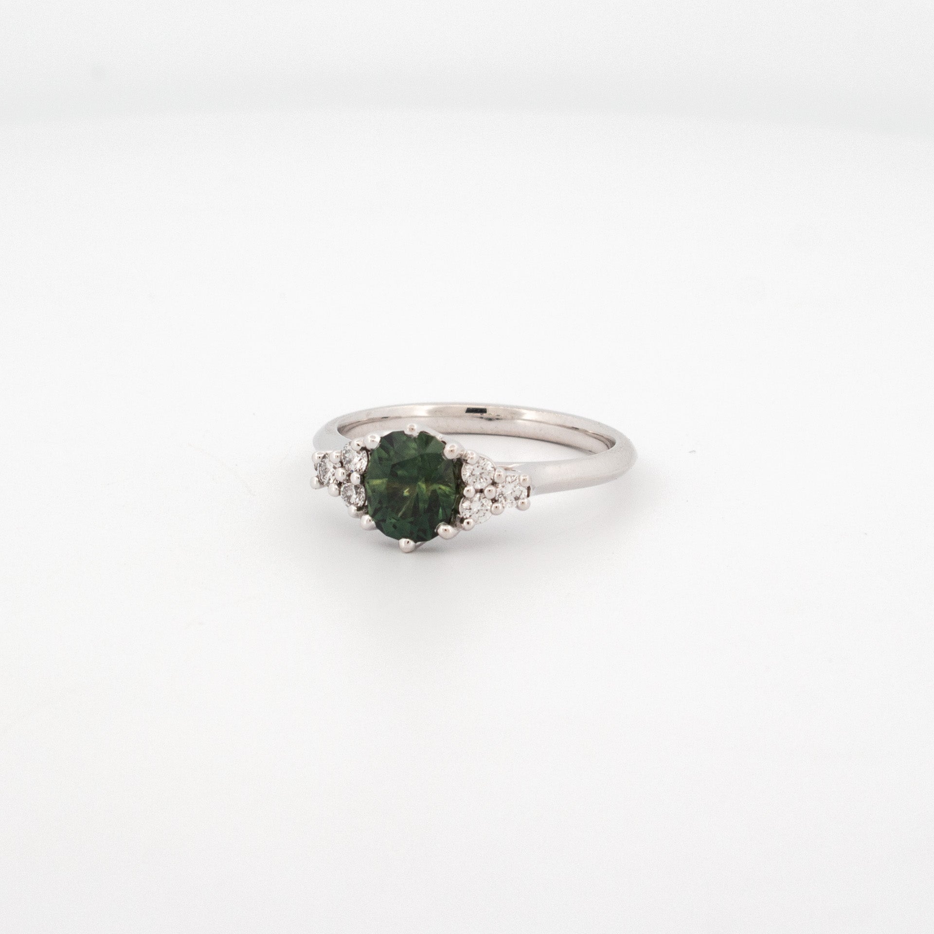A stunning fancy cut Australian Parti Sapphire, with lab grown diamond shoulder stones, set in 18ct white gold.
