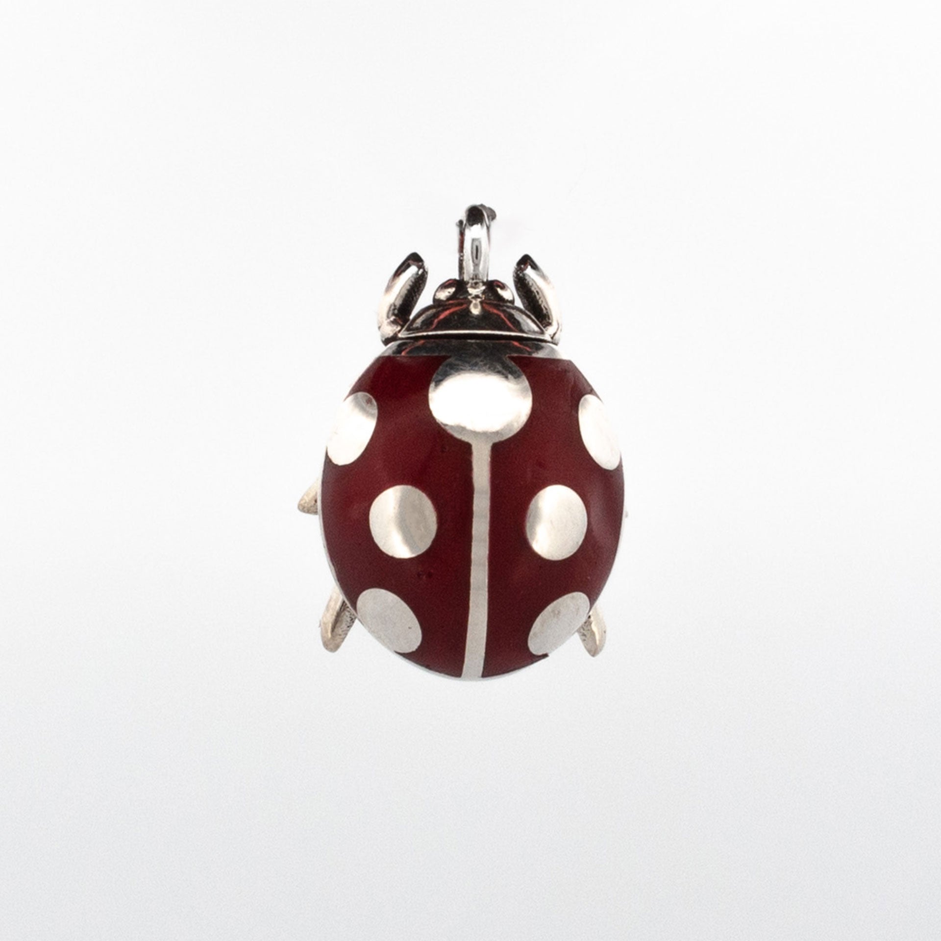 Large sterling silver ladybug pendant with red enamel body and polished silver spots, suspended on a silver chain.