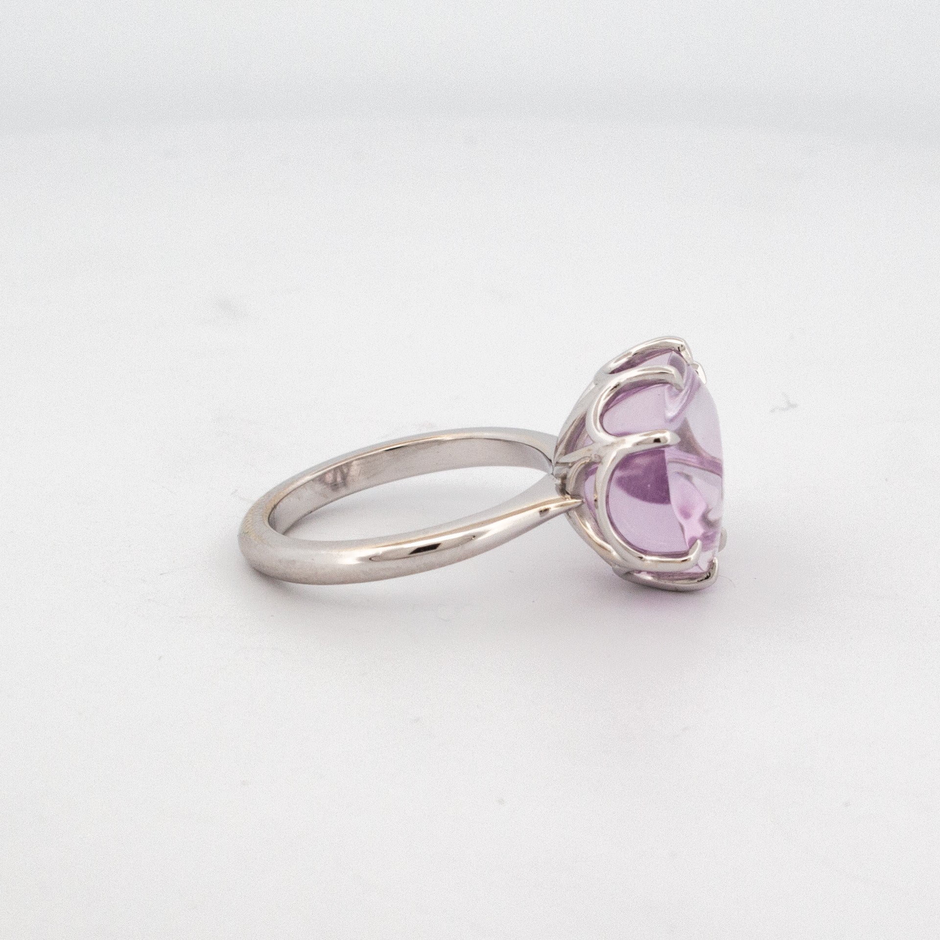 9ct white gold ring featuring an oval custom-cut lavender quartz with floral-style faceting and detailed claw setting.
