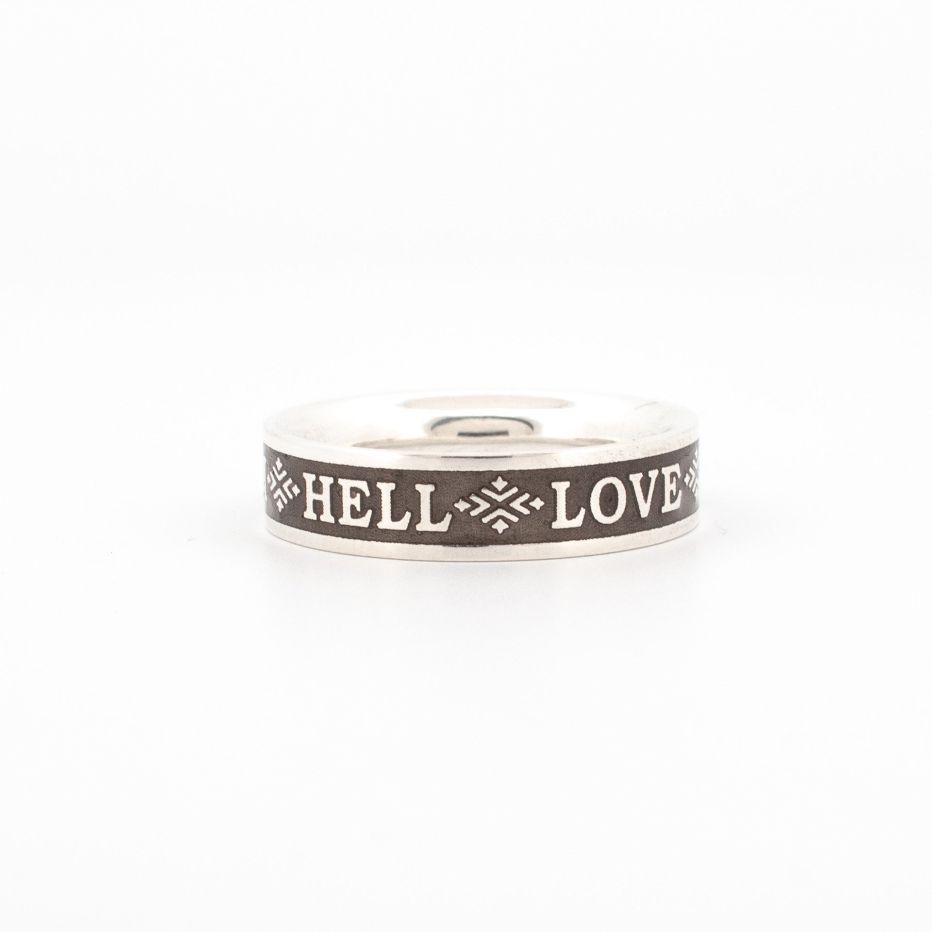 Sterling silver ring with black enamel inlay engraved with "HELL LOVE" and symbolic accents, part of Bukowski quote “Love is a Dog from Hell”.