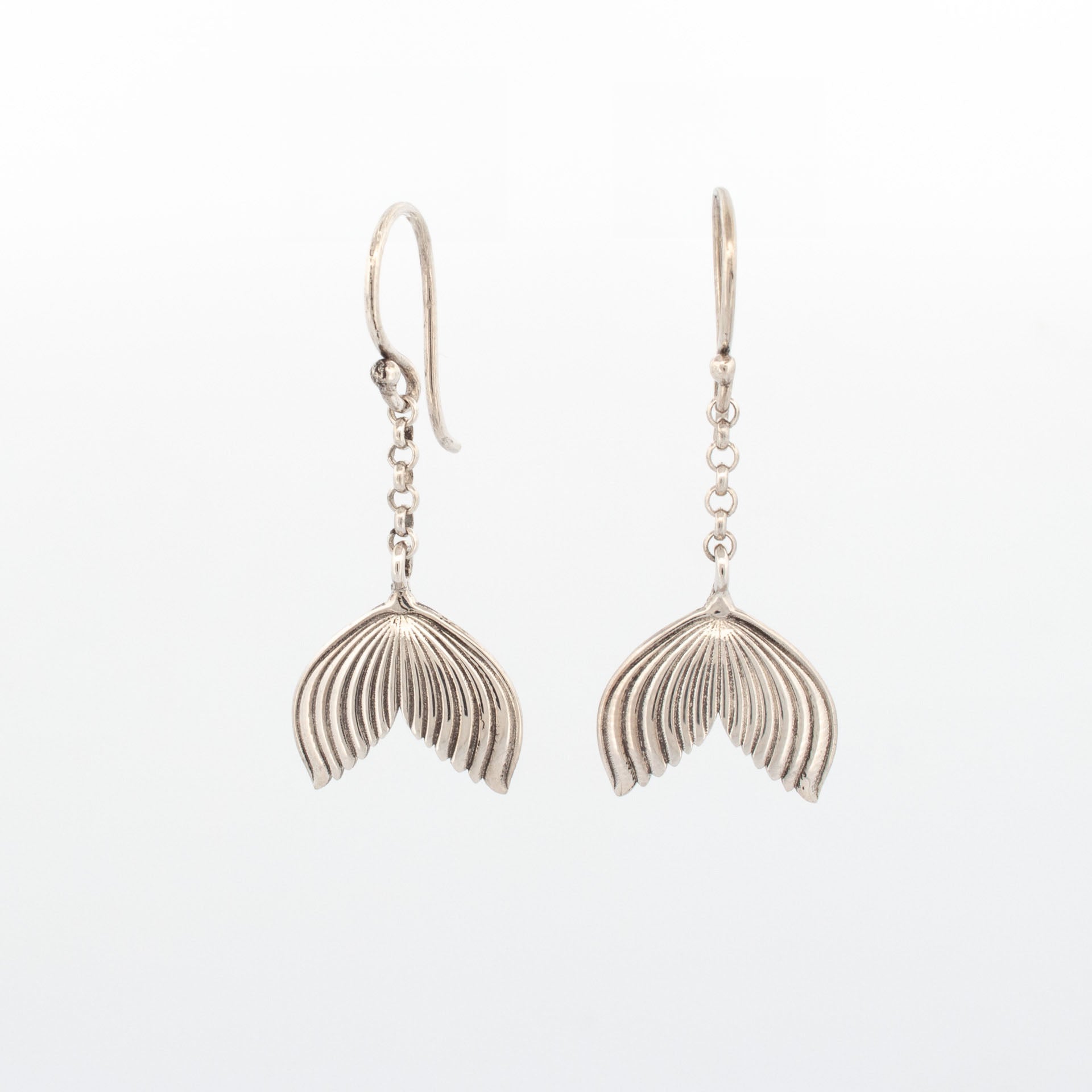 Sterling silver mermaid tail drop earrings with textured fin detail
