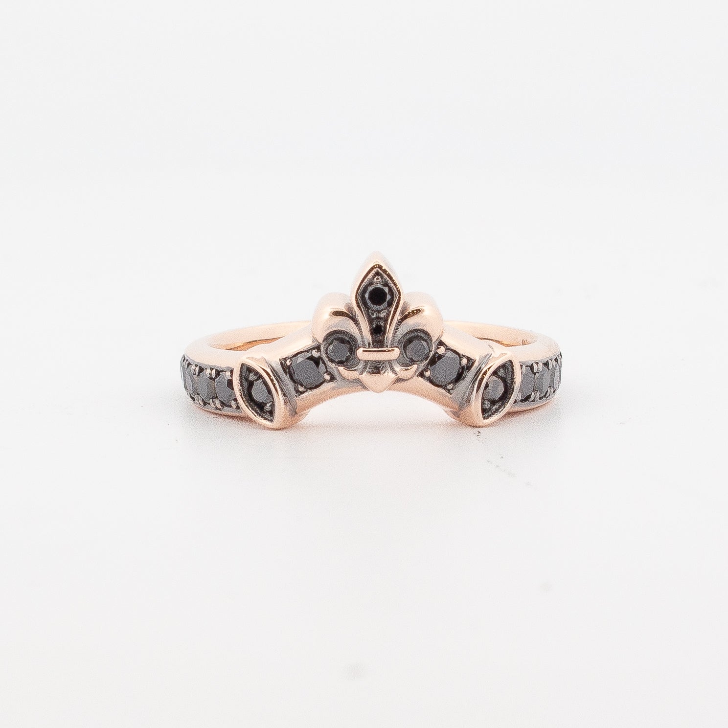 9ct rose gold fitted ring set with round black diamonds and black rhodium detailing, featuring a fleur-de-lis motif; designed to pair with the Medieval Treasure Garnet Ring.