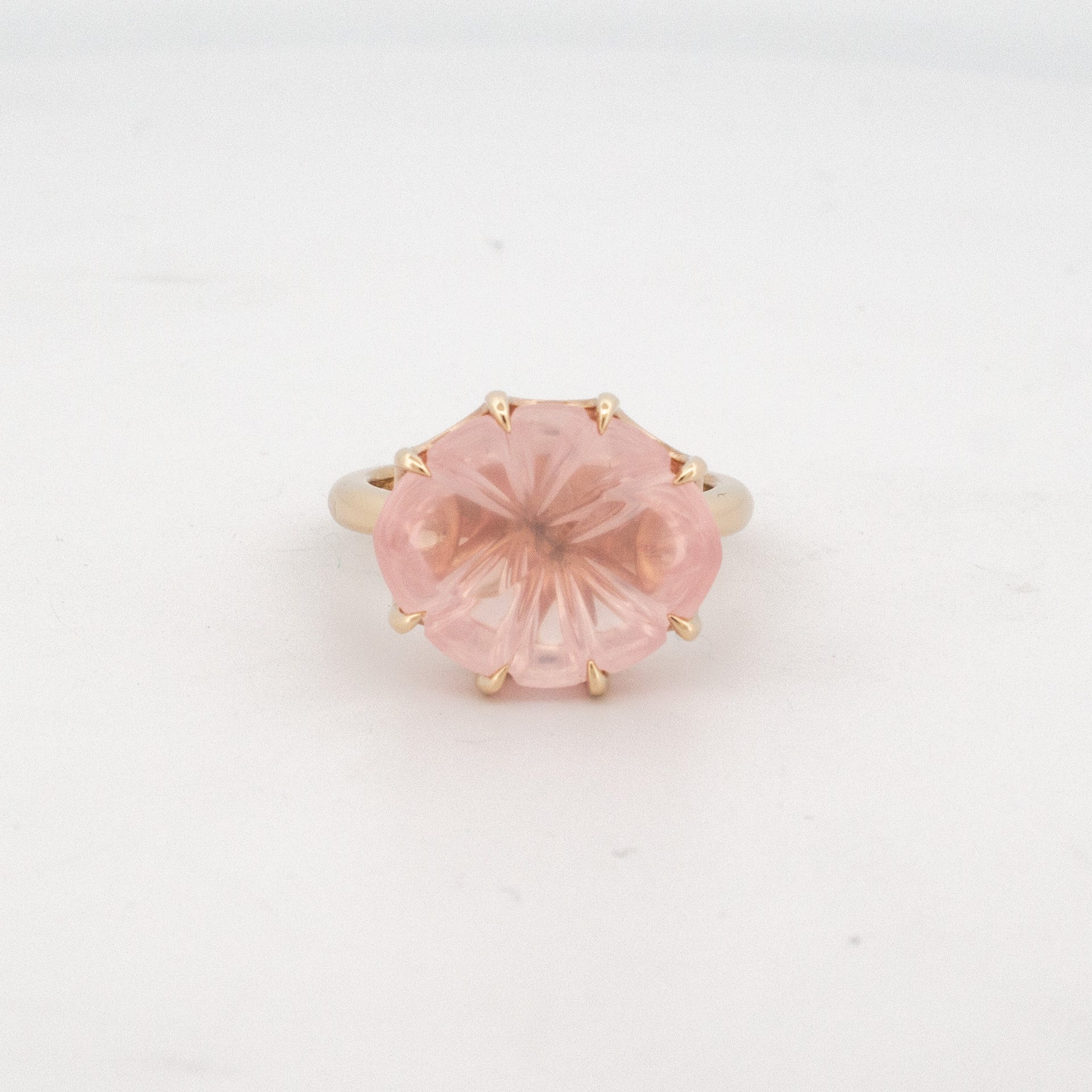 9ct yellow gold ring with custom-cut rose quartz in floral faceted design and matching detailed basket setting.