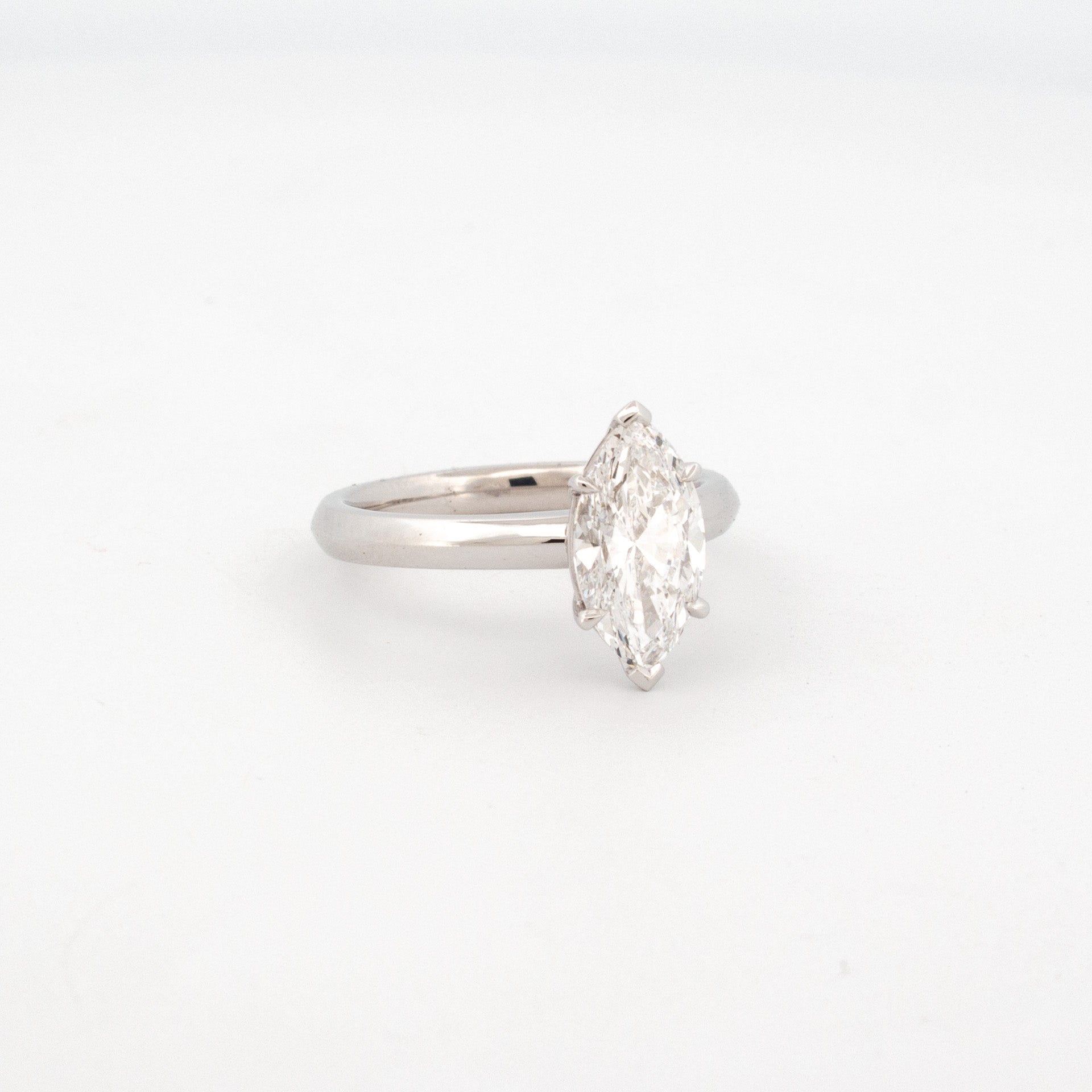 18ct white gold ring with marquise-cut 1.85ct lab grown diamond in six-claw setting and polished band.