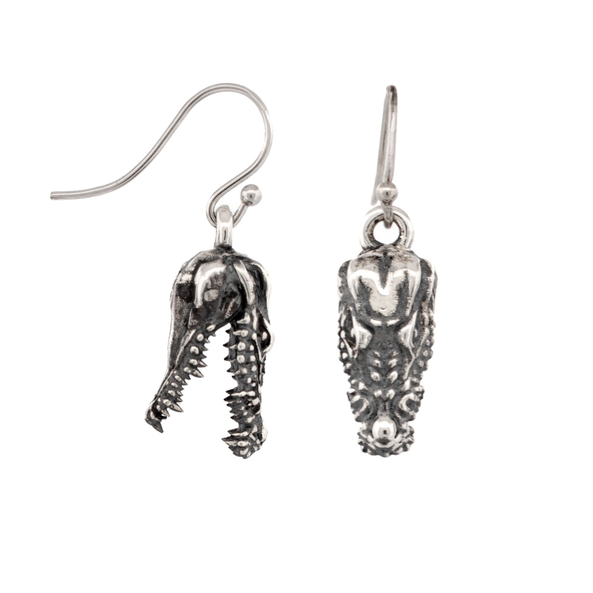 Sterling silver drop earrings featuring detailed three-dimensional crocodile skulls with oxidised finish and curved hook fittings.