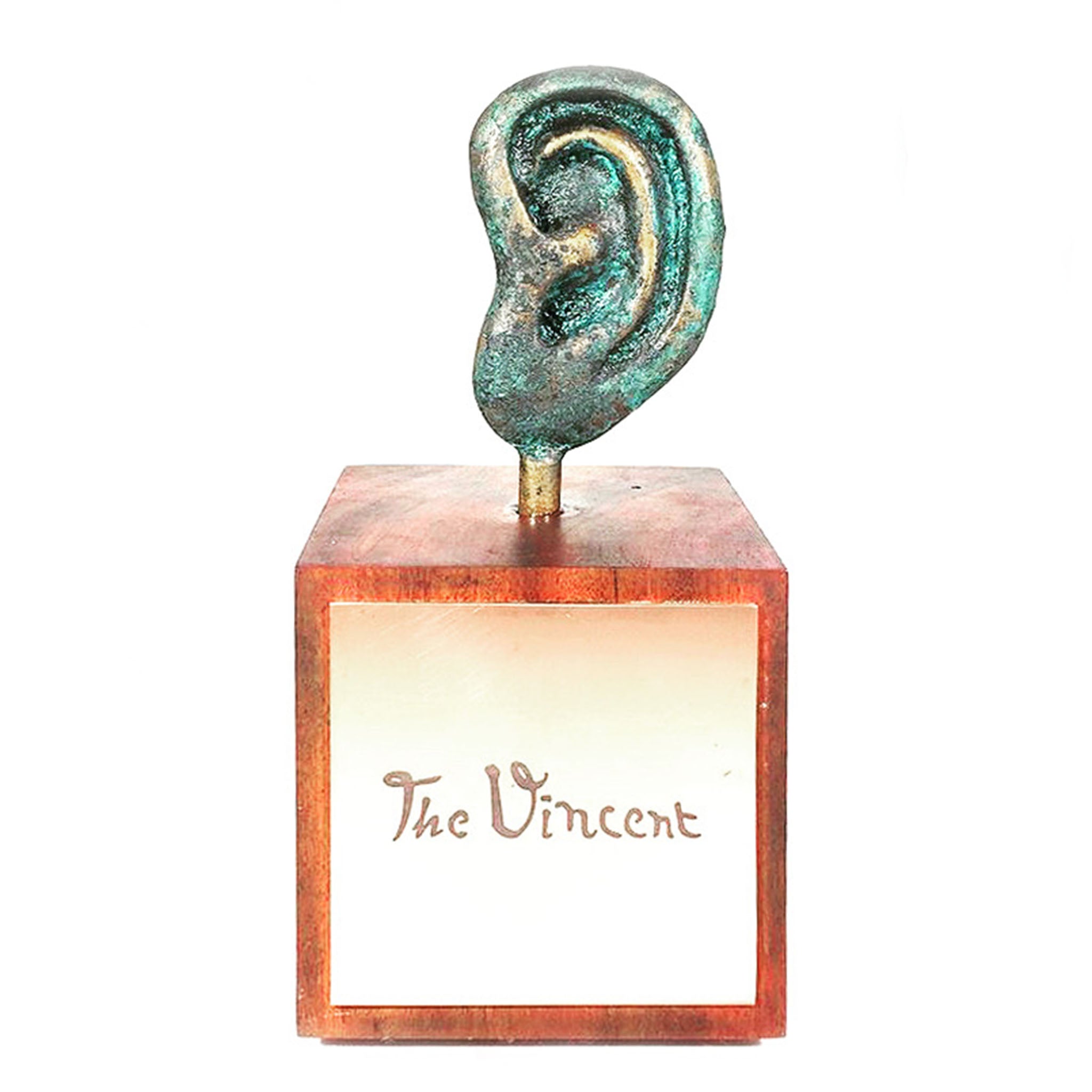 Bronze ear sculpture with green patina mounted on polished wooden block base inscribed with “The Vincent.”
