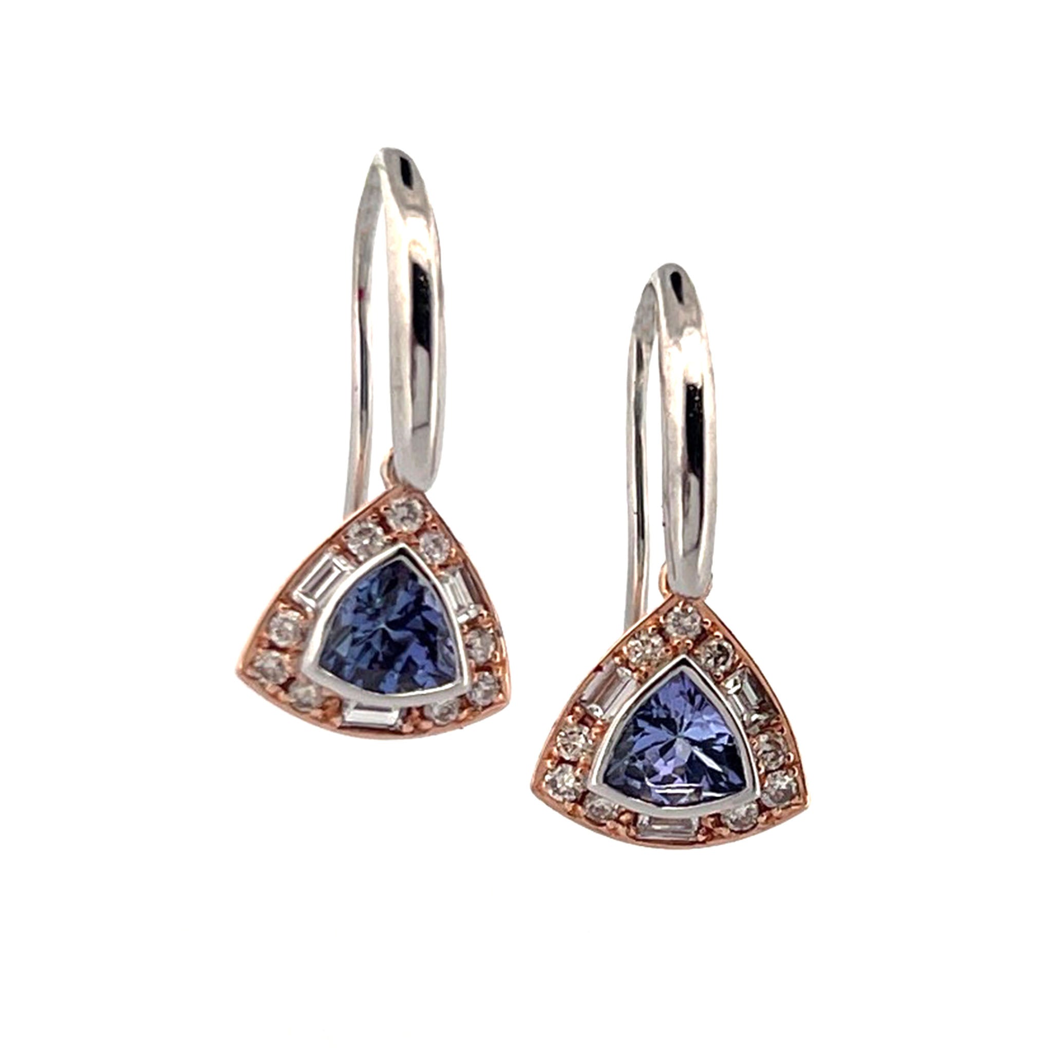 Drop earrings featuring triangular-cut tanzanites bezel-set in white gold, surrounded by a halo of round brilliant and baguette cut diamonds in rose gold, with white gold hooks.