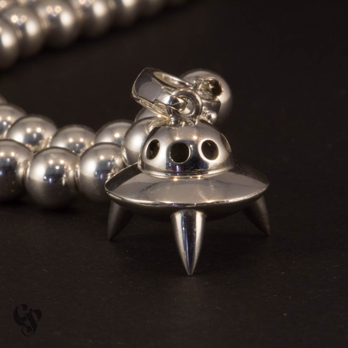 Sterling silver UFO spaceship pendant necklace with polished dome and spiked landing legs