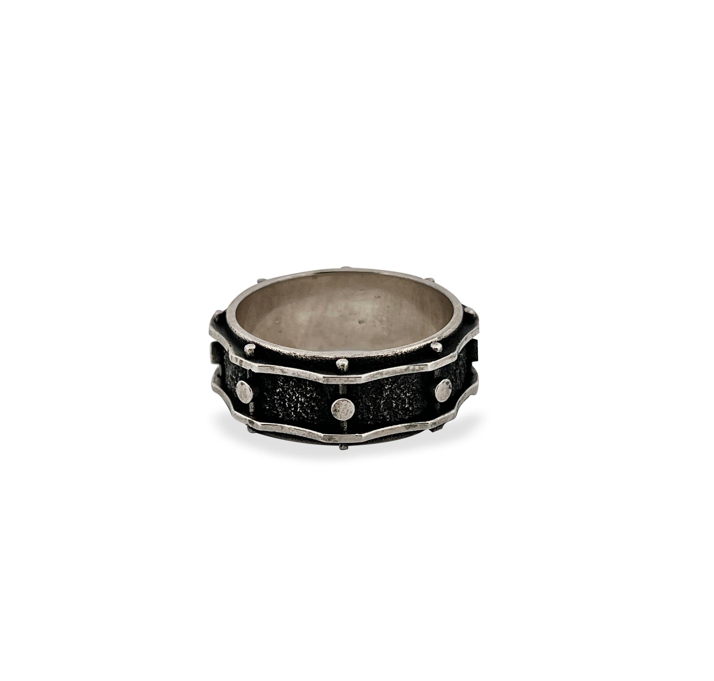 Sterling Silver Snare Drum Ring with oxidised textured detail and raised rivet accents, handmade silver band.