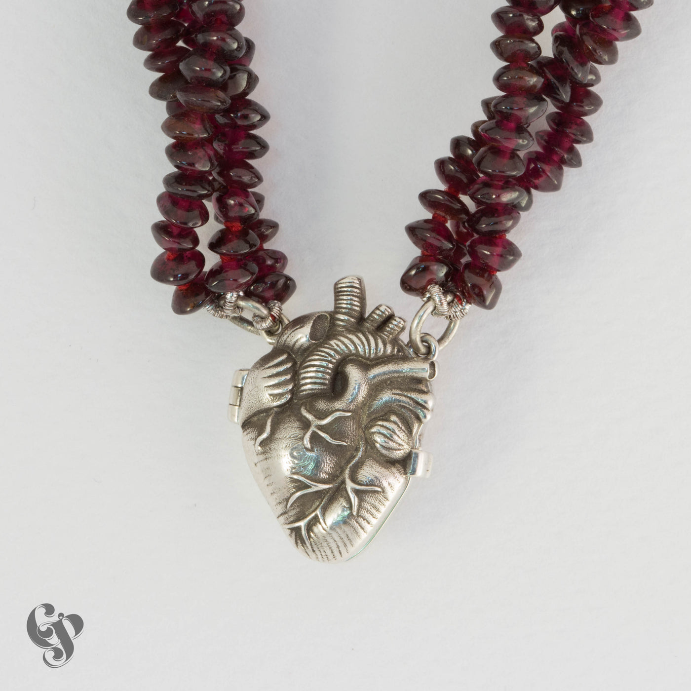 Sterling silver anatomical heart locket pendant with deep red garnet bead necklace