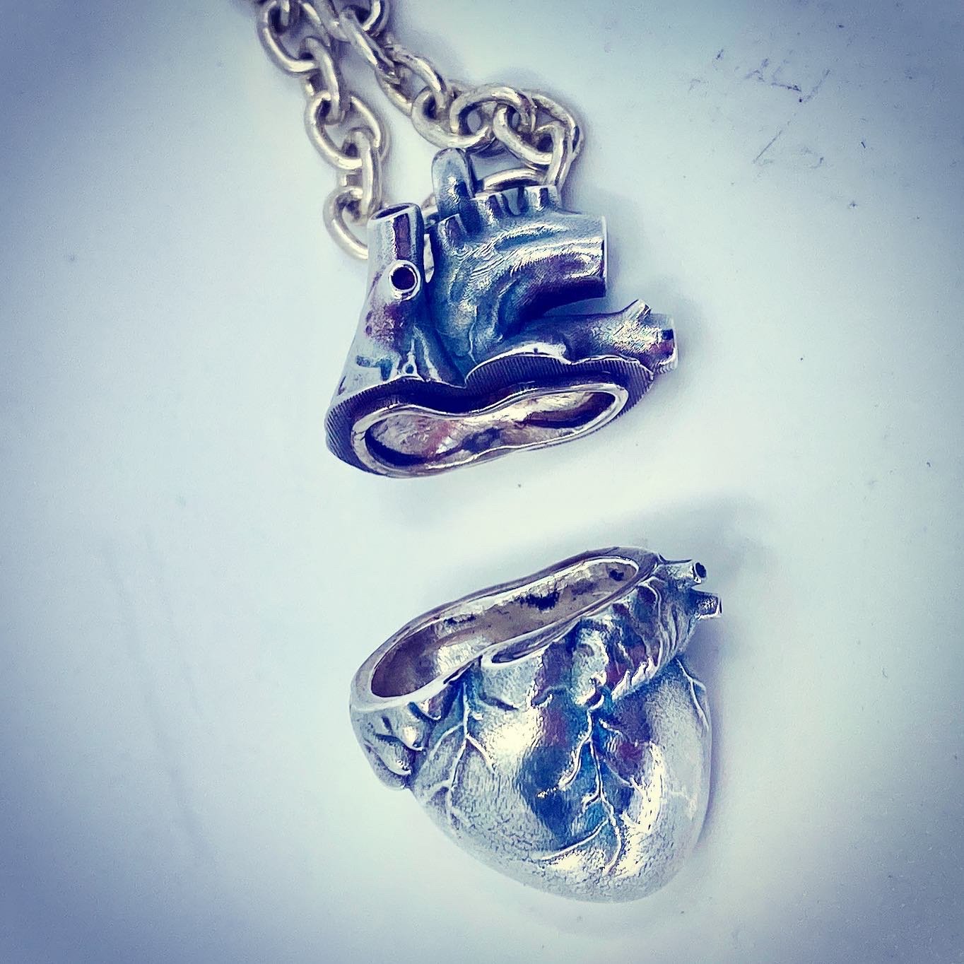 Sterling silver anatomical heart locket pendant with opening chamber on chain