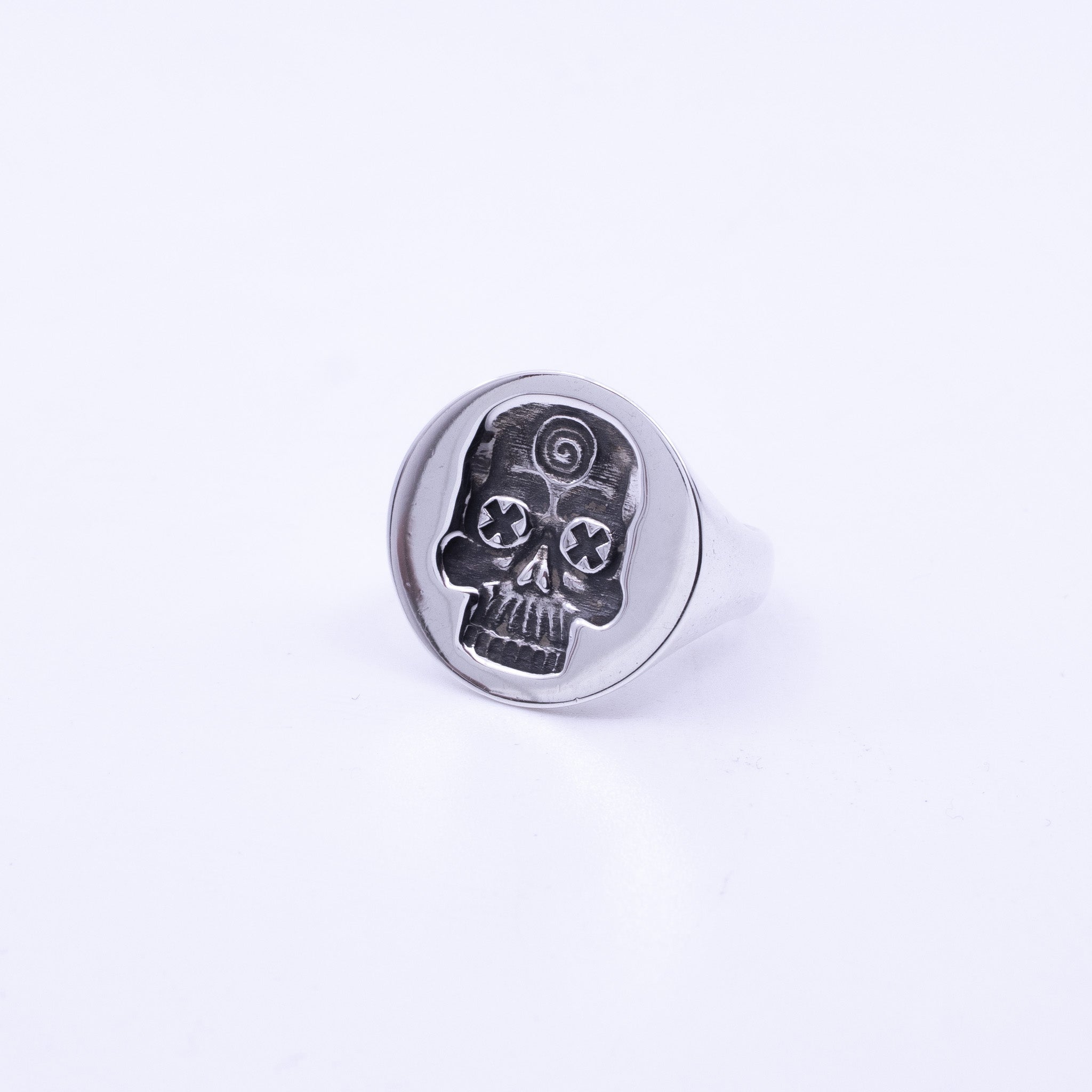 Sterling Silver Skull Ring with round face, engraved tripping skull design and oxidised detail, handmade silver signet ring.