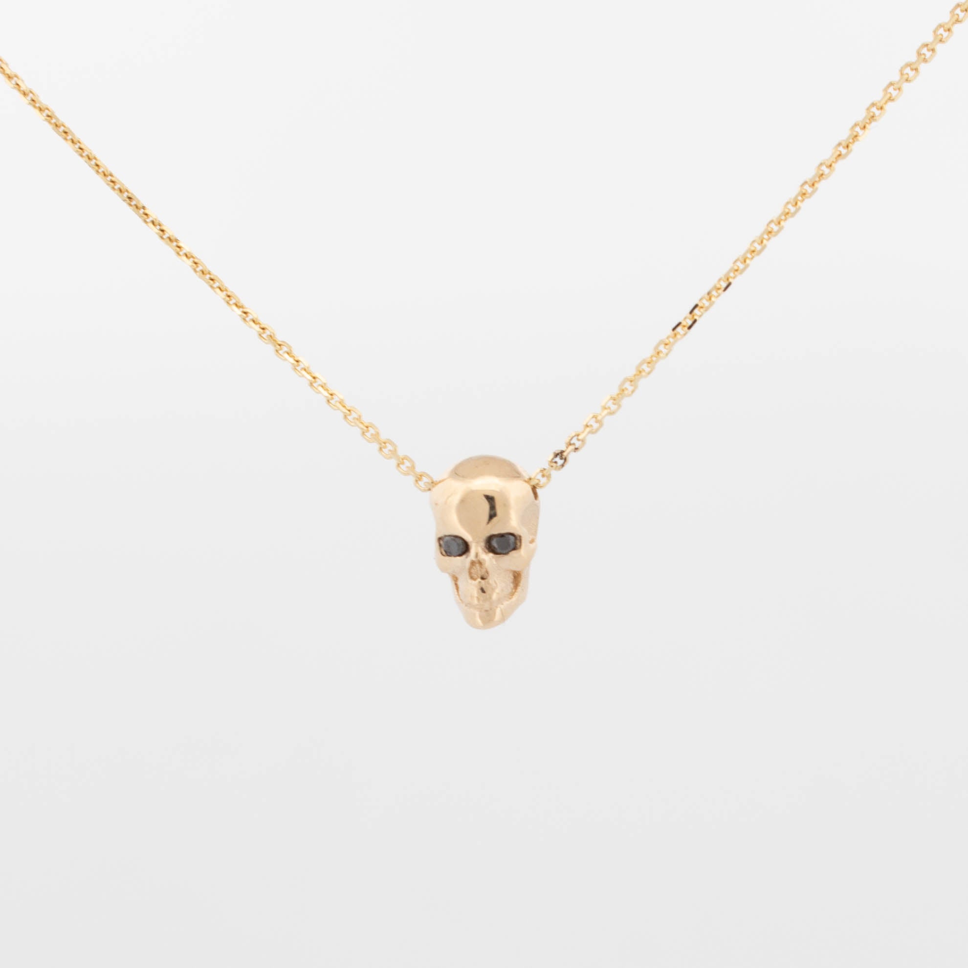 Mini Skull Pendant with Black Diamond Eyes
