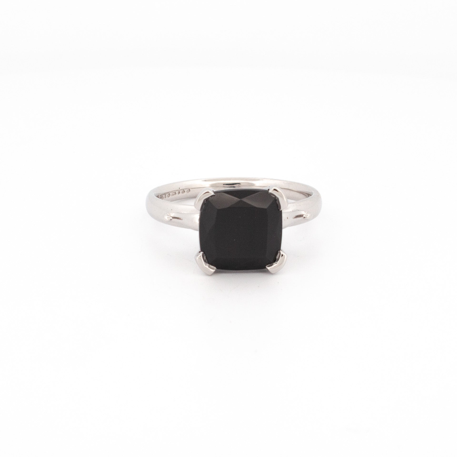 9ct white gold ring with cushion cut black spinel, four claw setting, polished band, handmade solitaire design