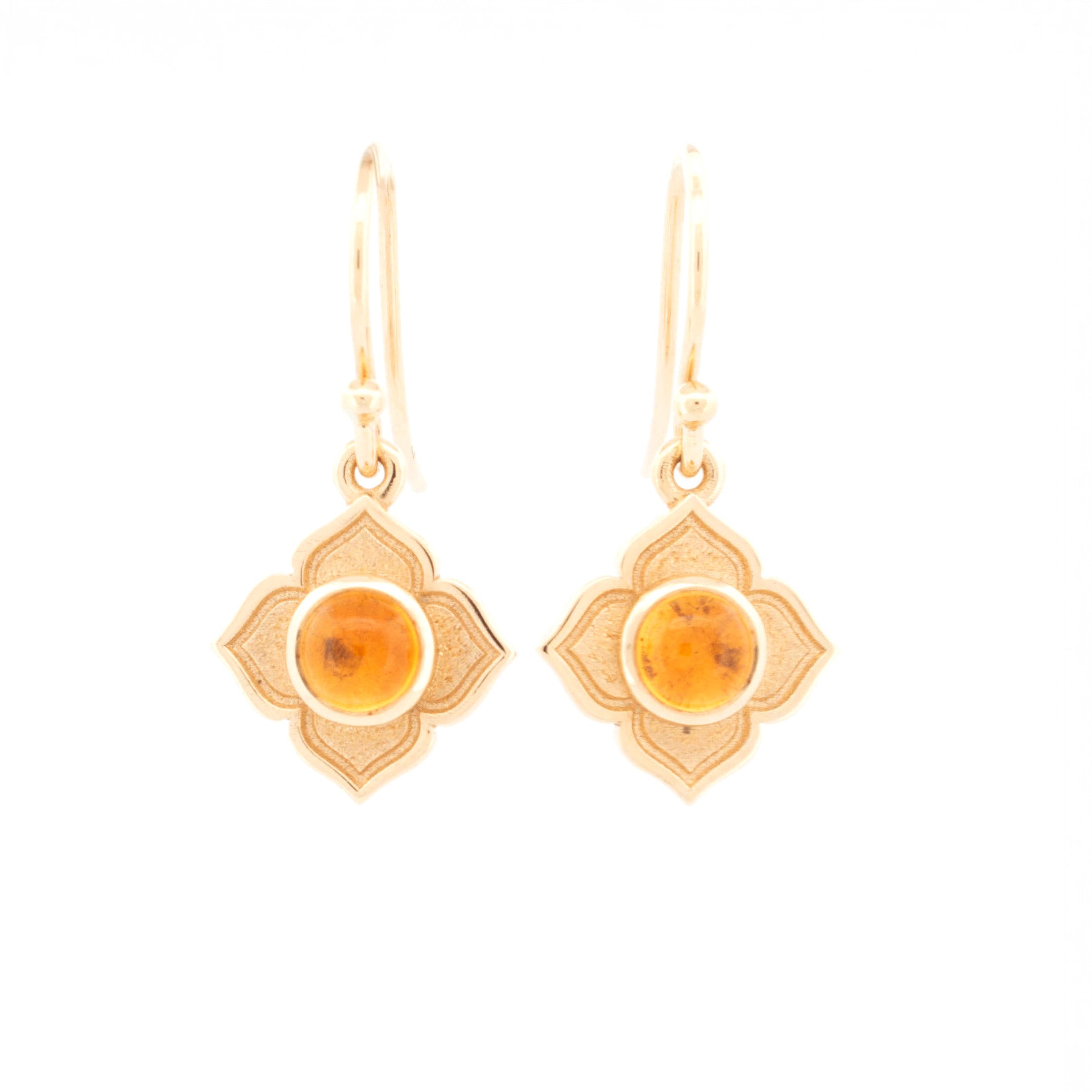 Pair of drop earrings featuring round cabochon citrine set in floral-shaped 9ct yellow gold mounts with matte and polished finish.