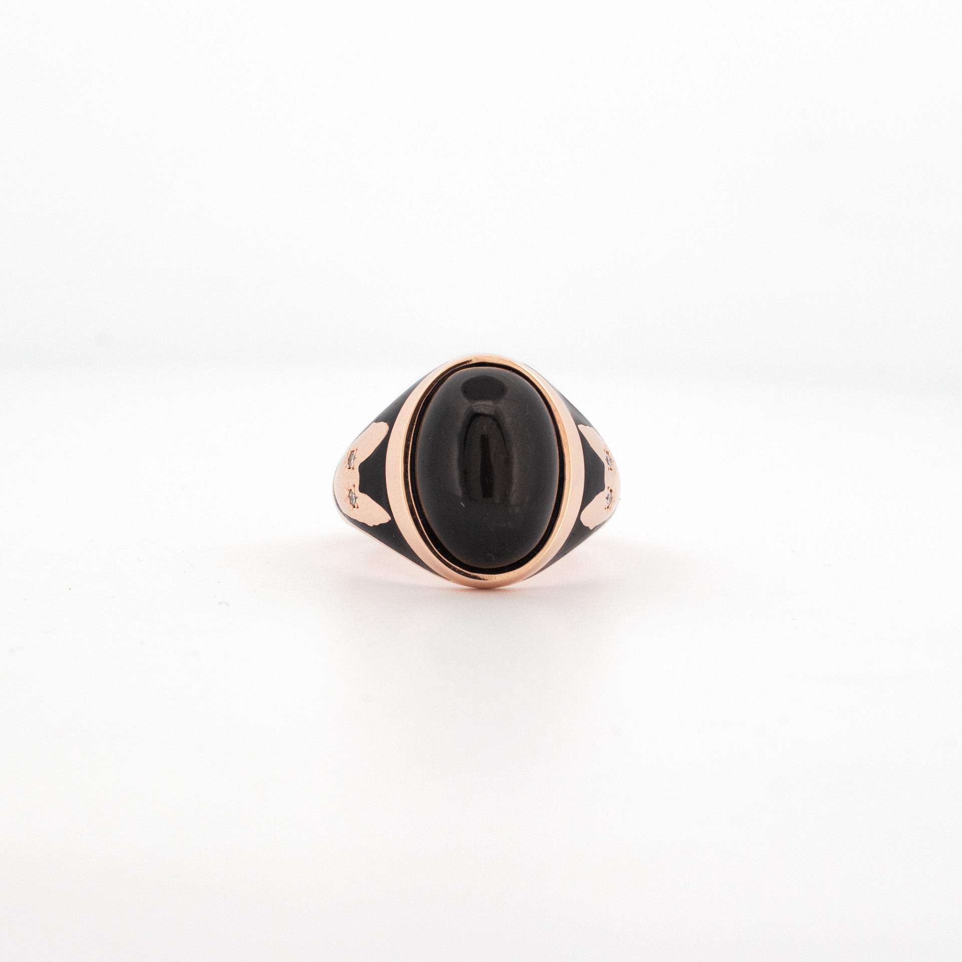 Rose gold ring featuring high-domed black cabochon with enamel detailing and Cornish Rex cat motif set with diamonds.