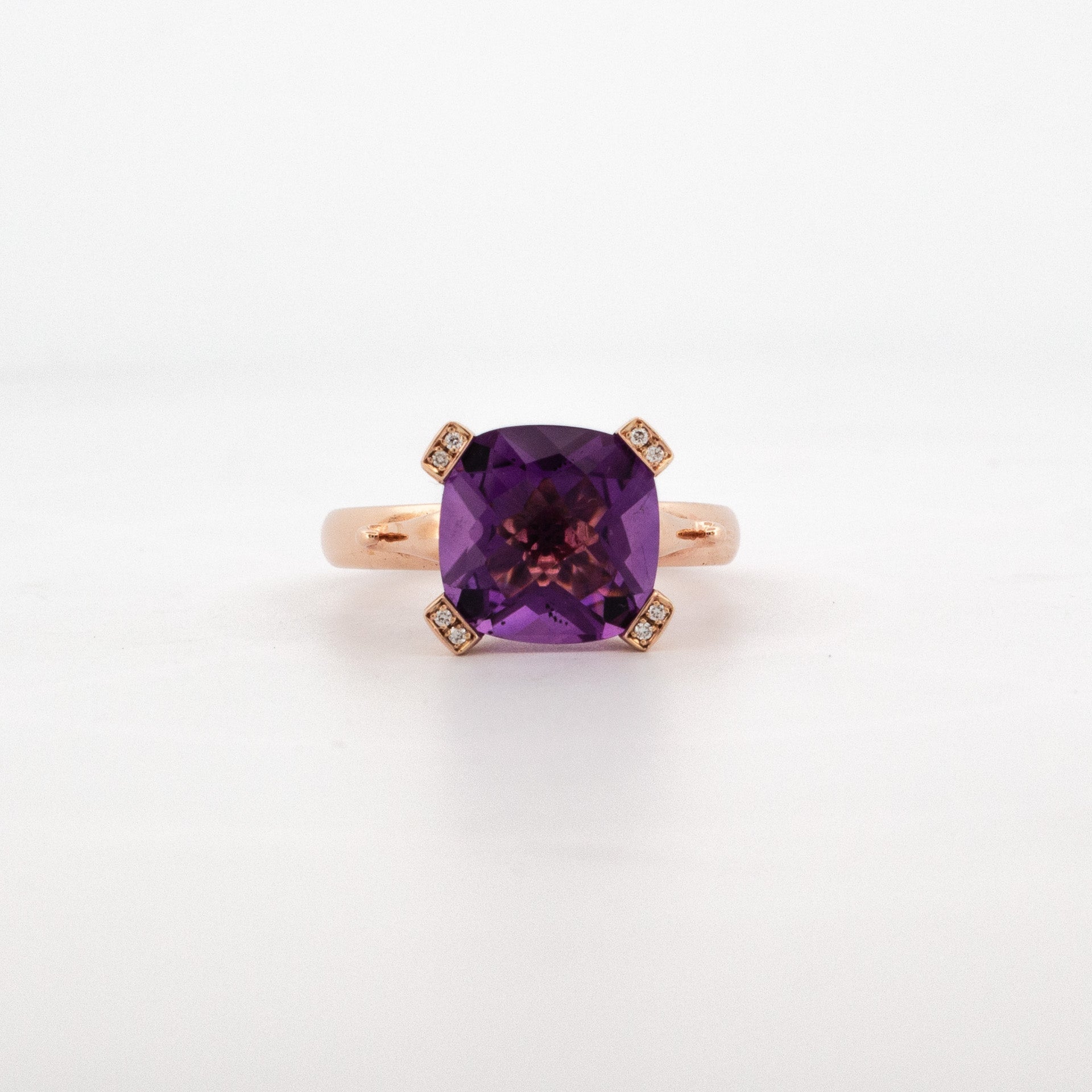9ct rose gold ring with 10mm cushion-cut amethyst and diamond-set claw prongs.