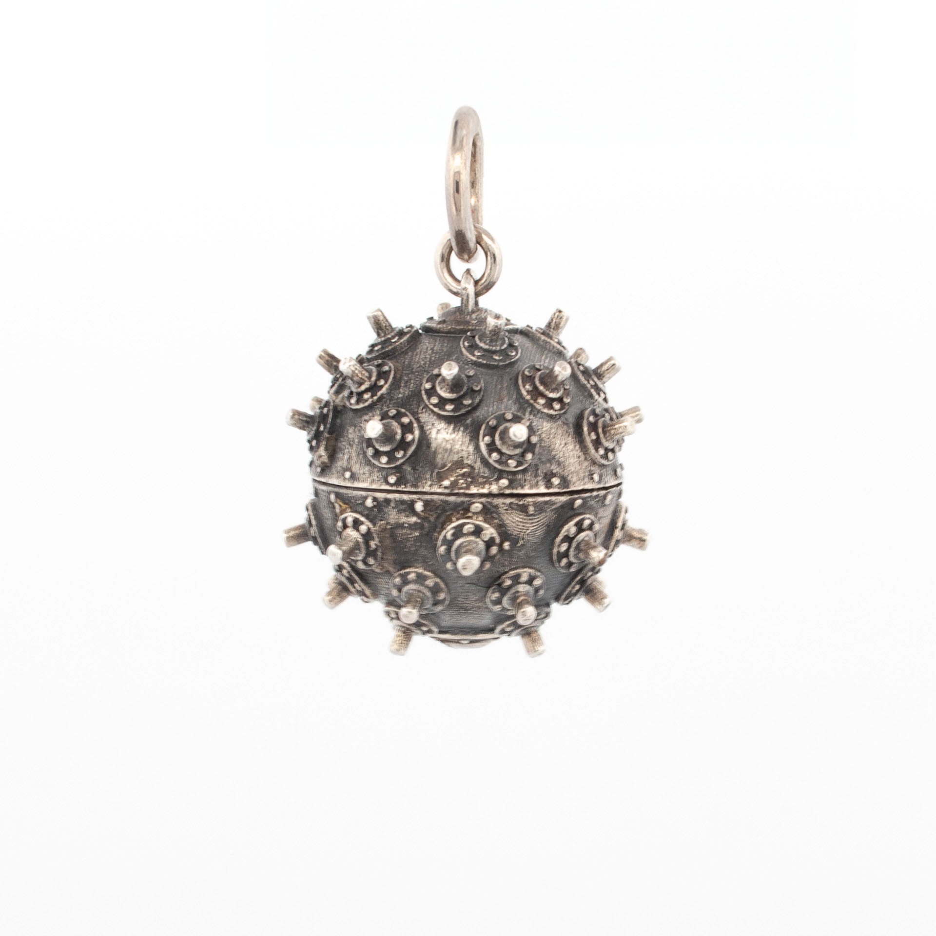 Sterling silver deep sea mine pendant with oxidised finish and raised stud detail