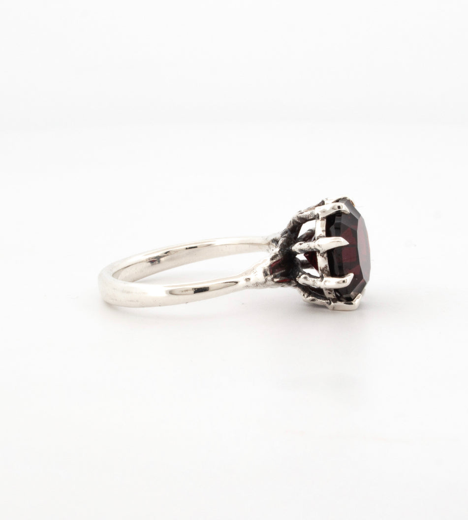 Sterling silver ring with custom cut deep red garnet, claw setting with sculpted talon prongs, gothic handmade design