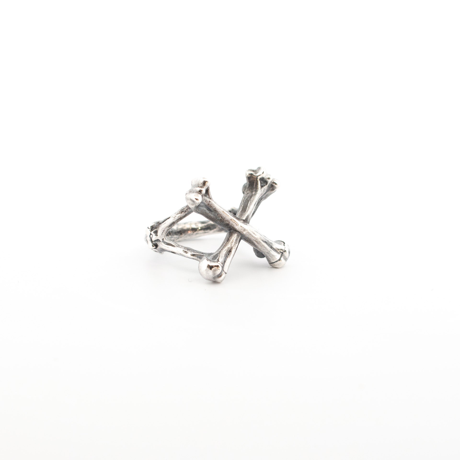 Sterling silver ring with sculpted crossbones design, 20mm wide front, textured handmade anatomical jewellery