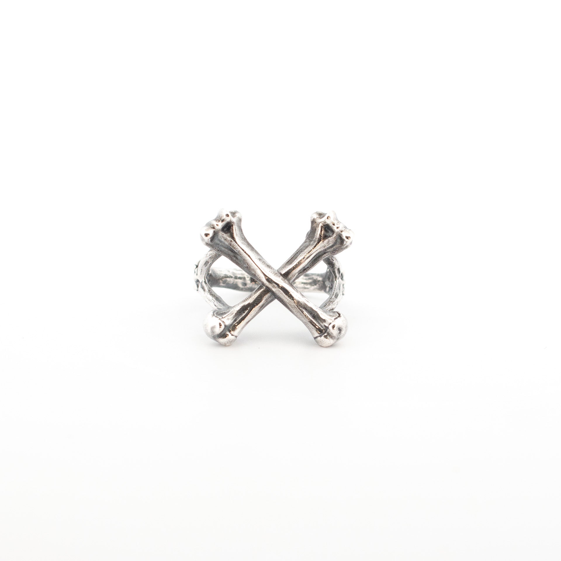 Sterling silver ring with sculpted crossbones design, 20mm wide front, textured handmade anatomical jewellery