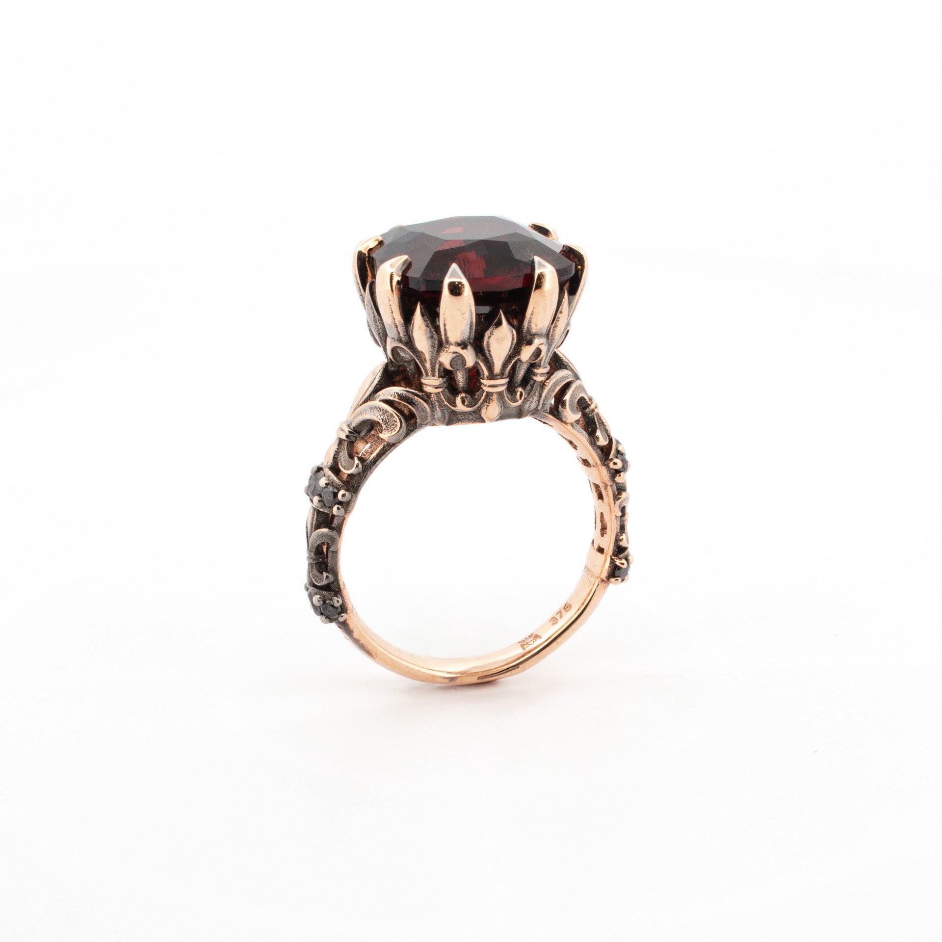 Large garnet ring in rose gold with ornate claw setting and sculpted gothic band, handmade statement jewellery