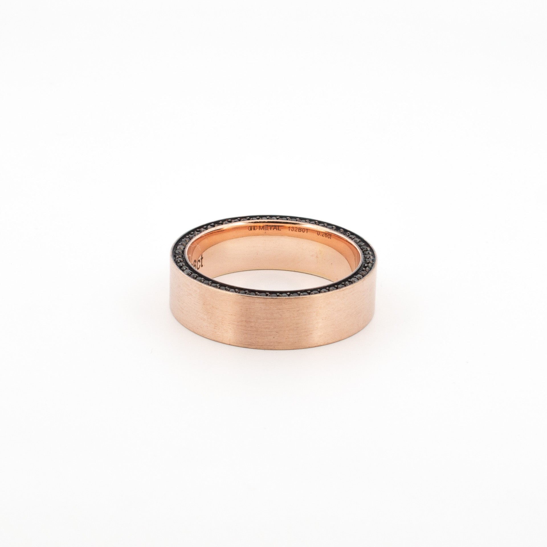 A bold and beautifully weighted 9ct rose gold ring with a clean, flat profile and softly brushed finish. One edge is meticulously bead set with a fine row of black diamonds
