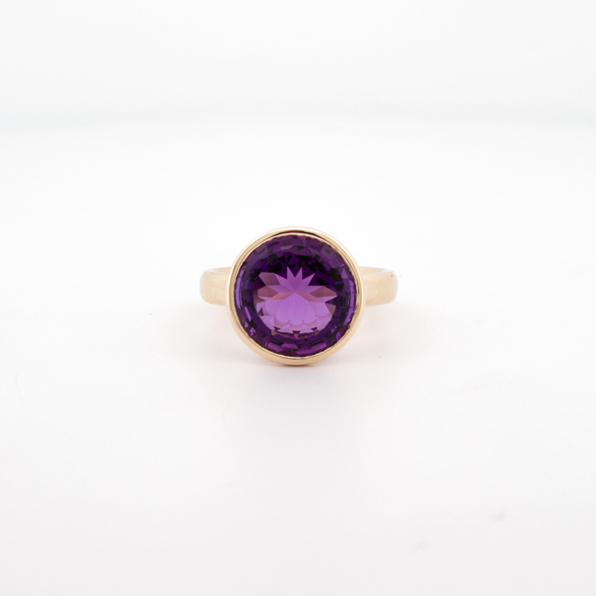 9ct yellow gold ring with 12mm round custom-cut amethyst in bezel setting, handmade jewellery Newtown.