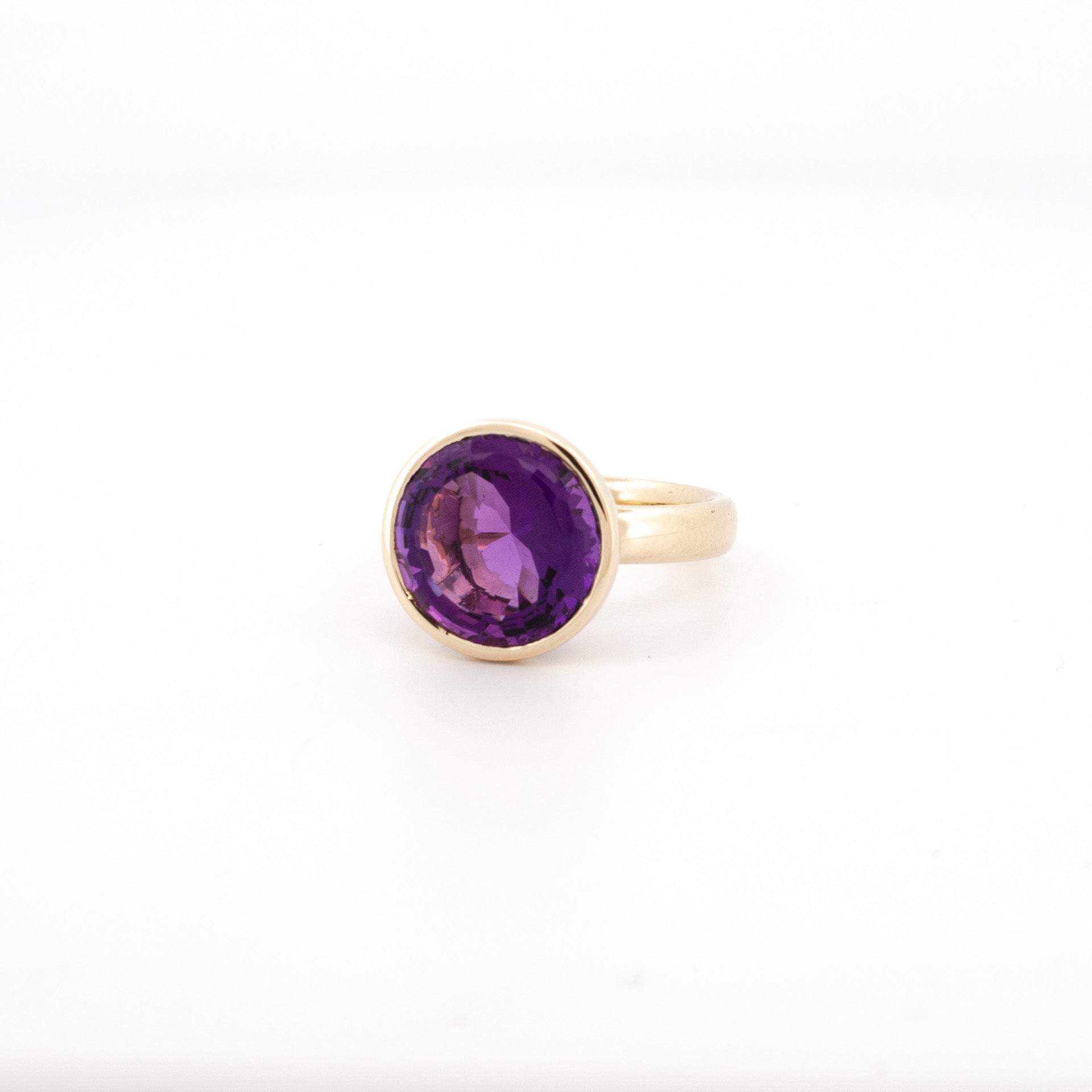 9ct yellow gold ring with 12mm round custom-cut amethyst in bezel setting, handmade jewellery Newtown.