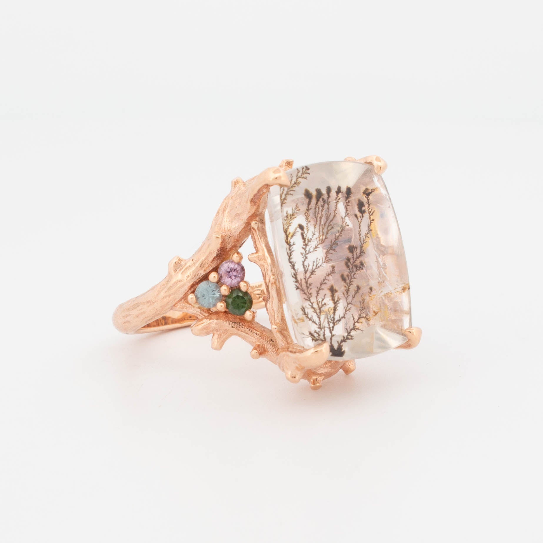 Dendritic Quartz Forest Ring in 9ct rose gold featuring a large rectangular dendritic quartz with natural branch-like inclusions, flanked by faceted multi-coloured gemstones in a textured, organic-style setting