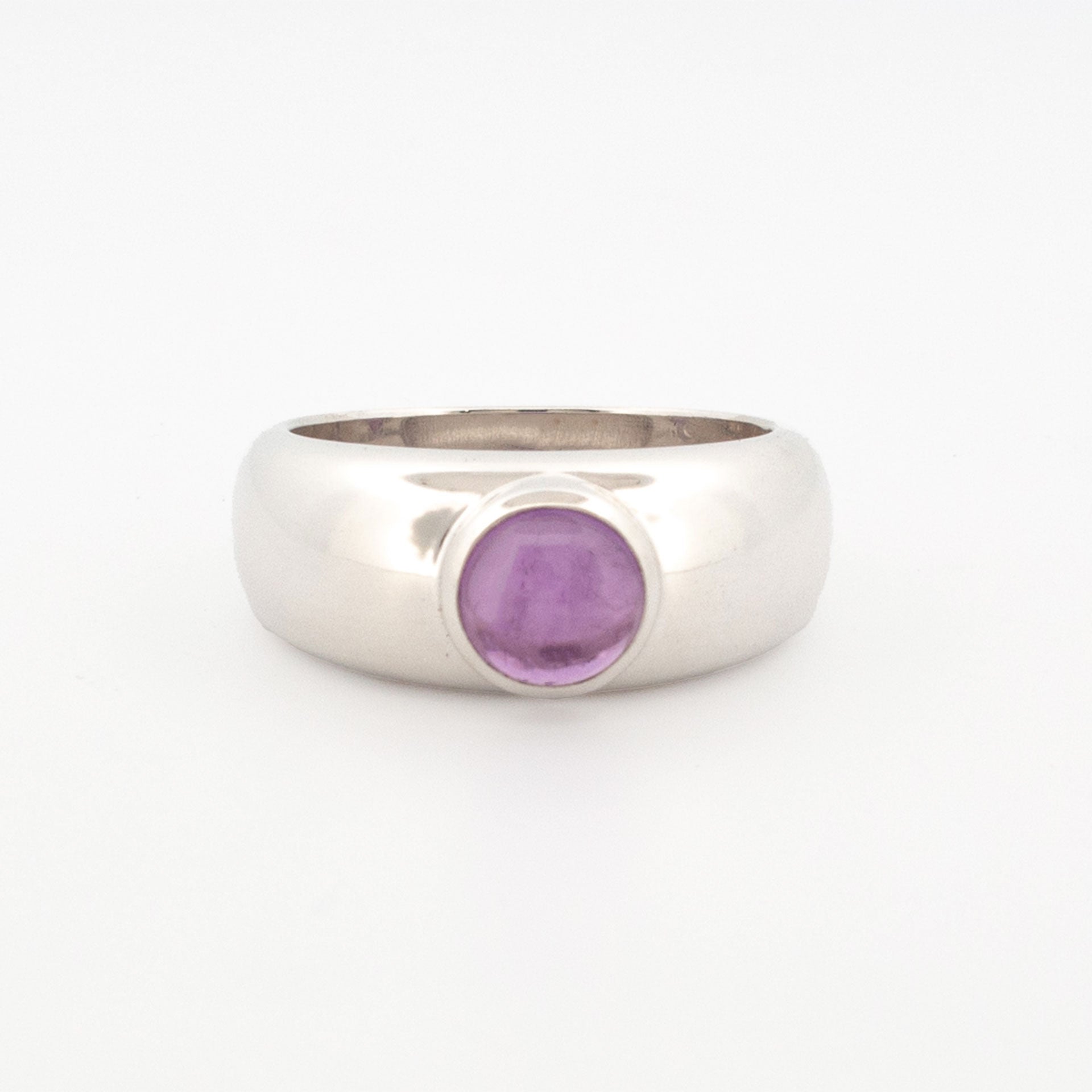 Sterling silver dome ring featuring a bezel-set 6mm round cabochon-cut amethyst.