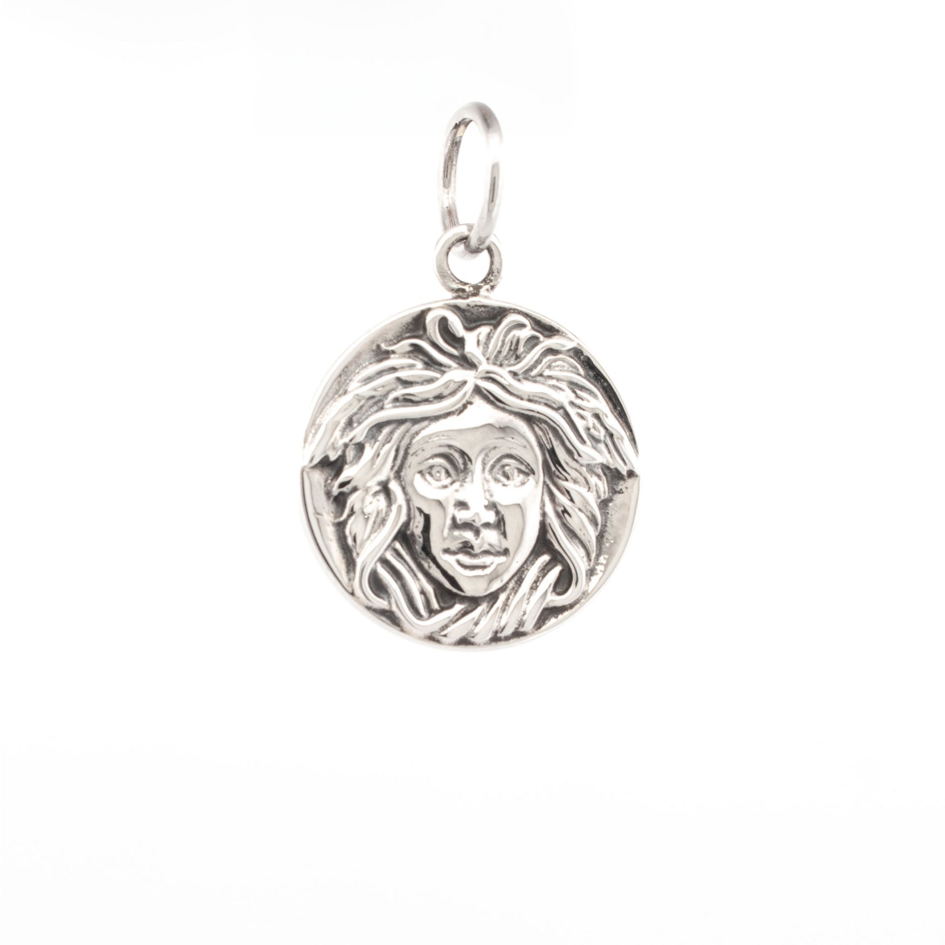 Sterling silver Medusa pendant with sculpted face and flowing snake-like hair in high relief.