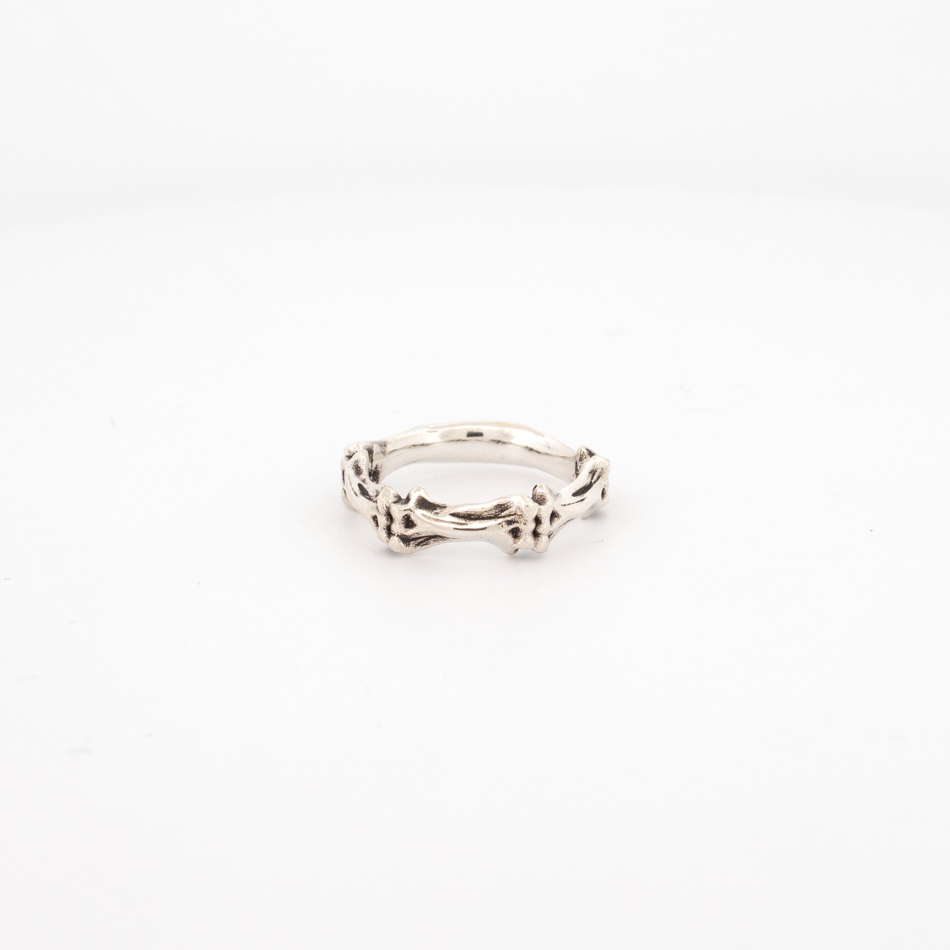 Sterling silver ring with three sculpted bone segments, 5mm wide band, handmade anatomical design