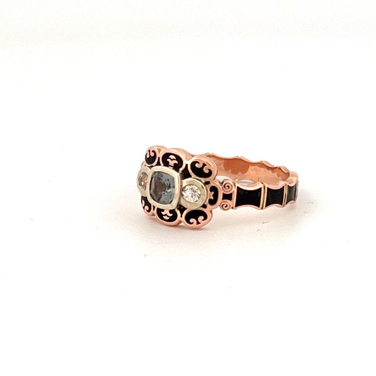 9ct rose gold Victorian mourning style ring with 4.5mm cushion cut grey spinel, rose cut white topaz side stones, and black enamel detailing.