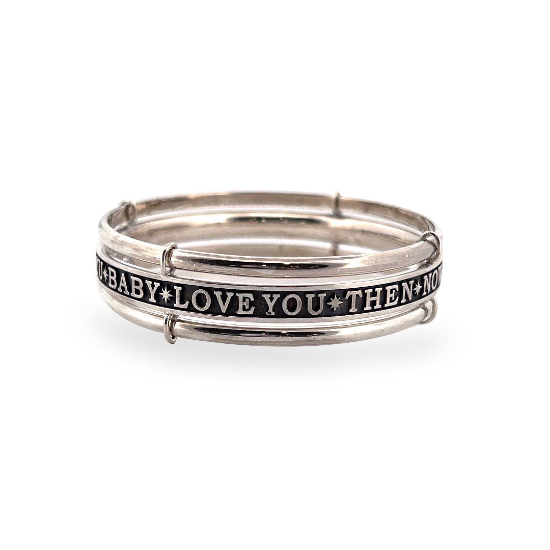 Sterling silver engraved bangle bracelet with black enamel lettering reading personal message, custom-made as a memorial keepsake gift.